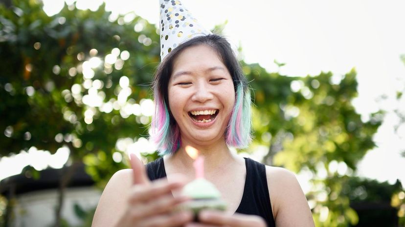 Woman with rainbow hair at birthday party