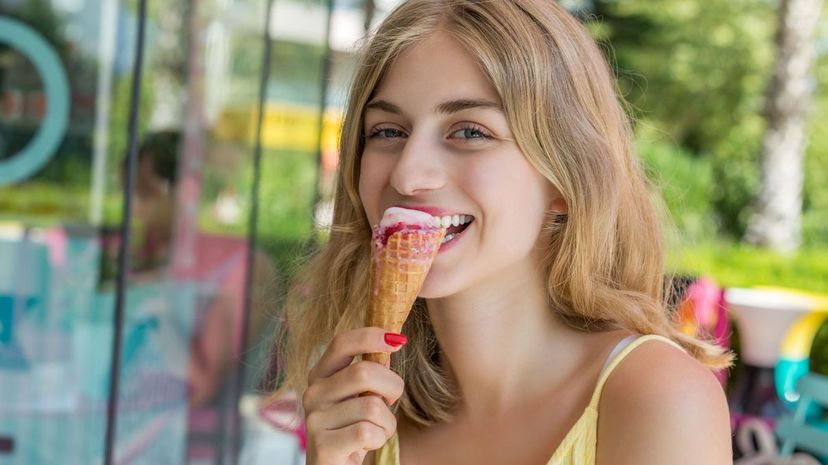 Young woman eating ice cream cone