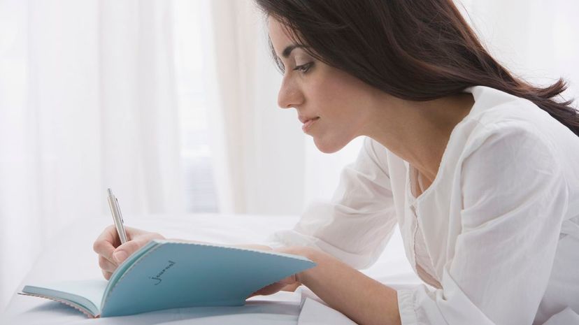 Woman writing journal