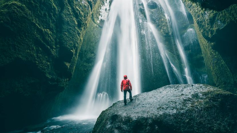 Tourist Admiring Waterfall