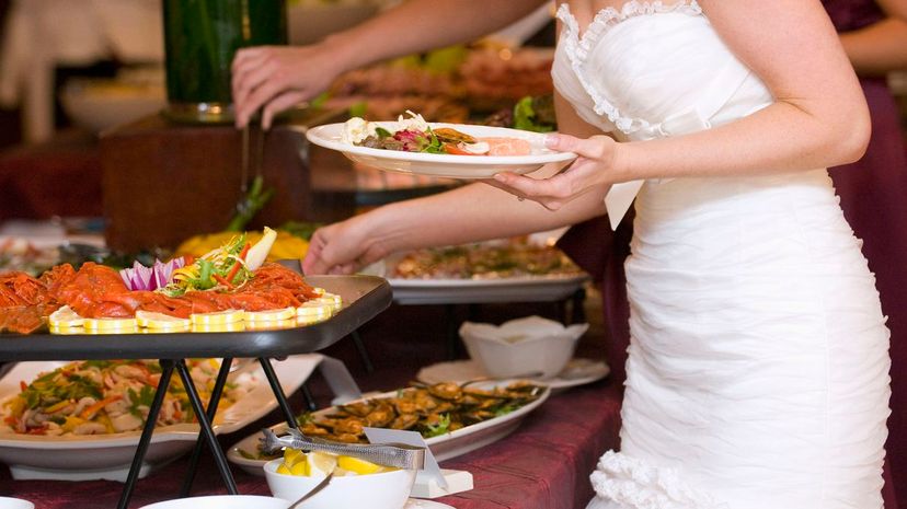 Bride getting food from buffet