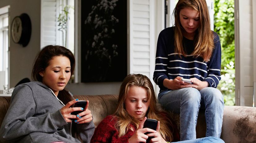 Girls using smartphones