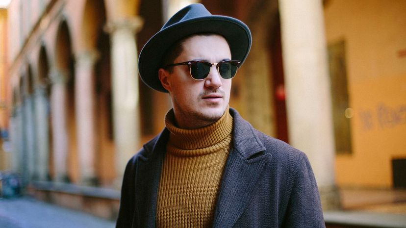 Young man in hat and sunglasses