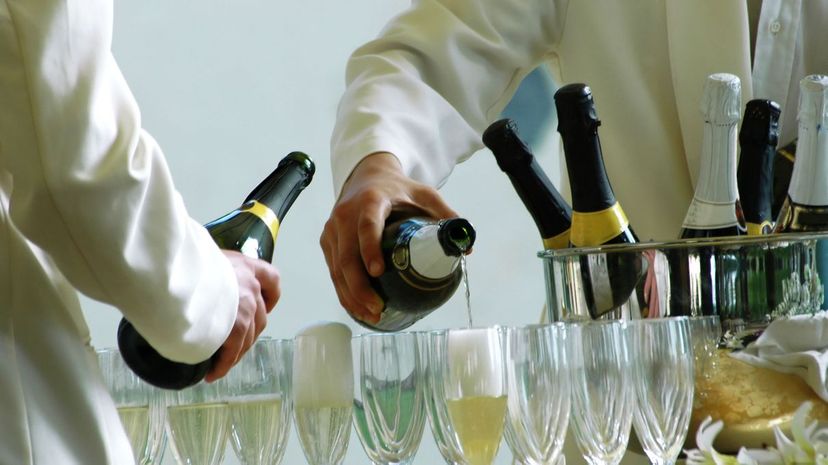Waiters serving champagne at a wedding party