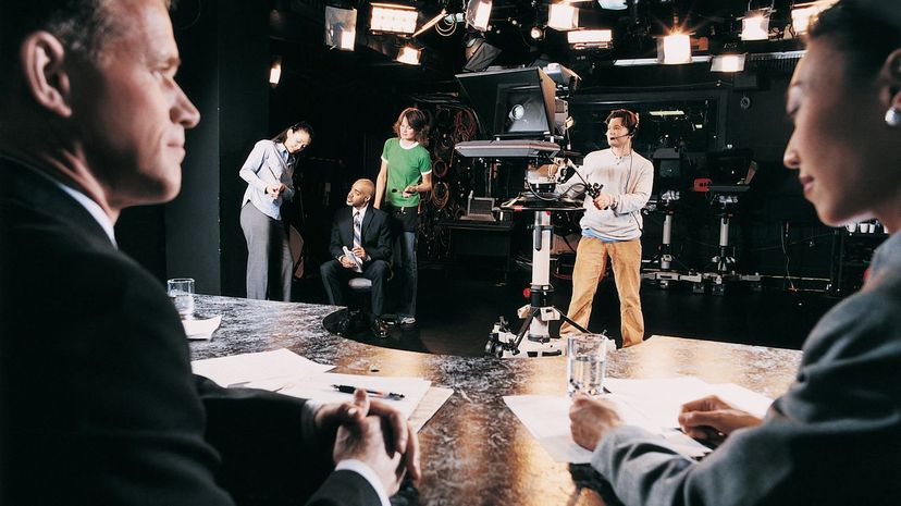 TV Presenters, Cameraman and Behind the Scenes Crew in a TV Studio