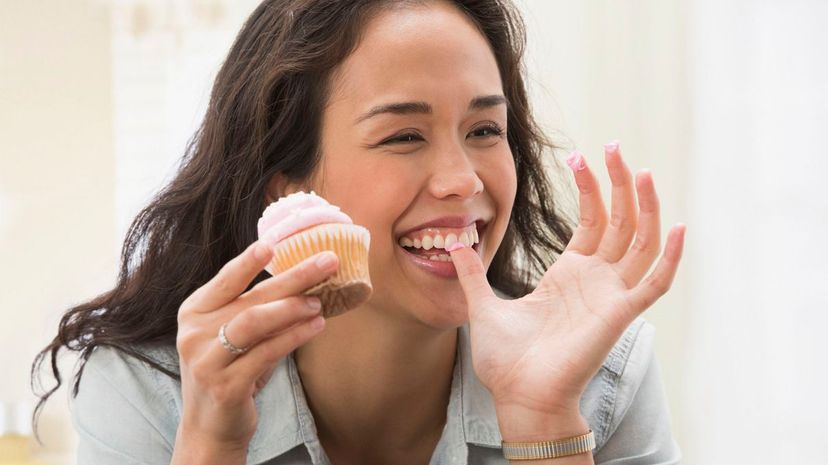 Woman eating cupcake