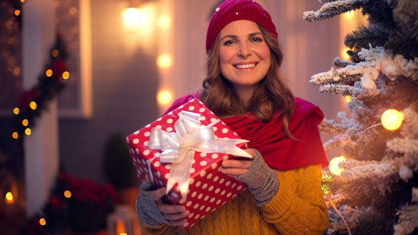 Woman holding christmas gift outdoor