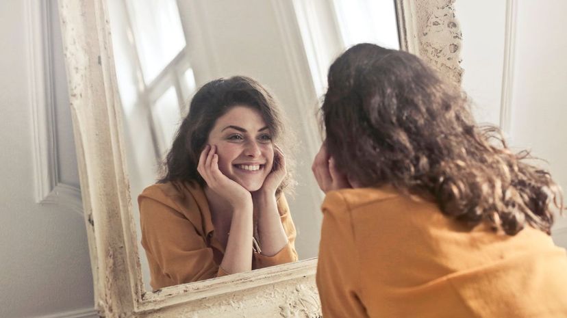 Smiling in Mirror
