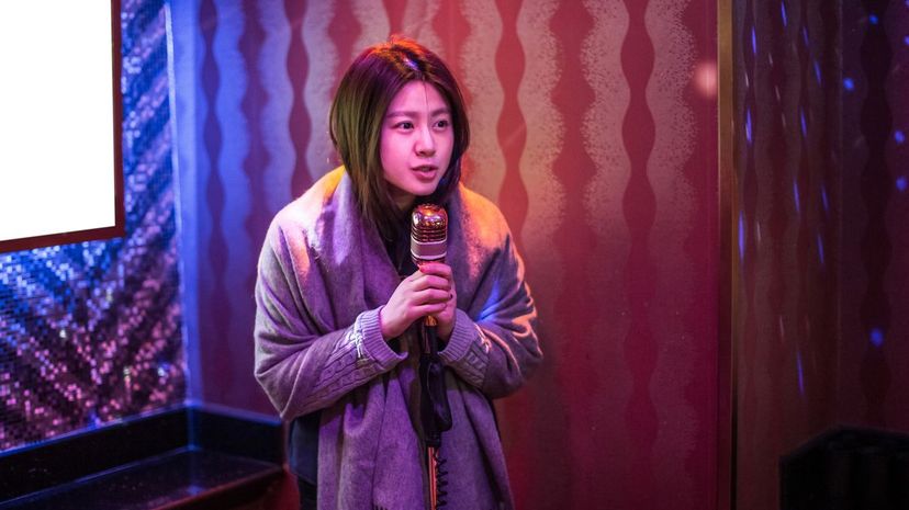 Girl singing into microphone