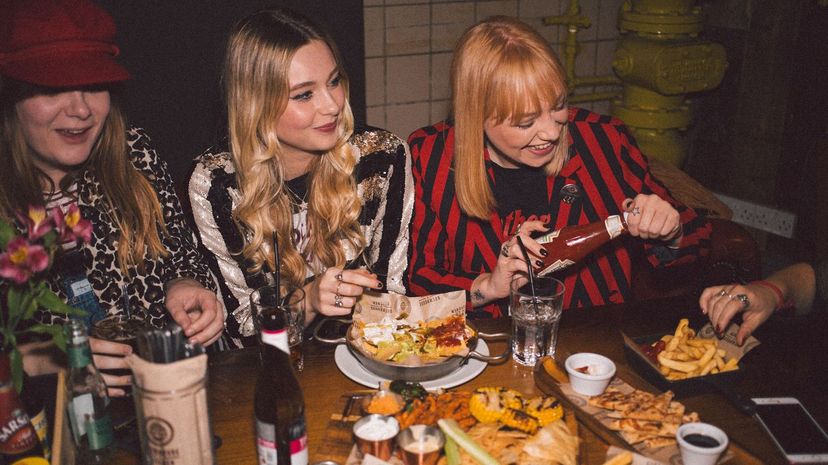 Girlfriends on a night out, eat and drink