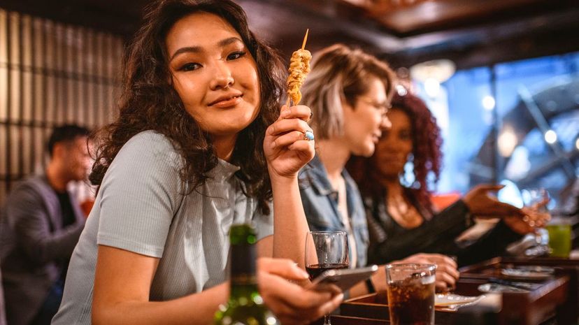 Woman with friends at bar