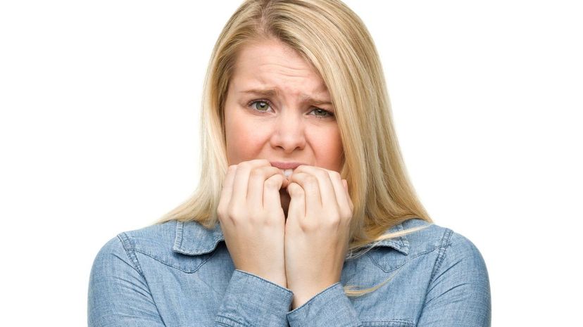 Nervous Young Woman Biting Nail