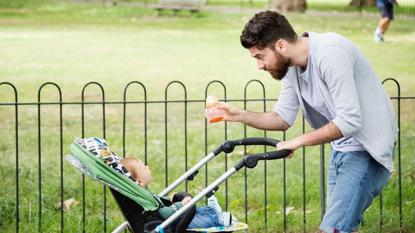 Man with baby stroller