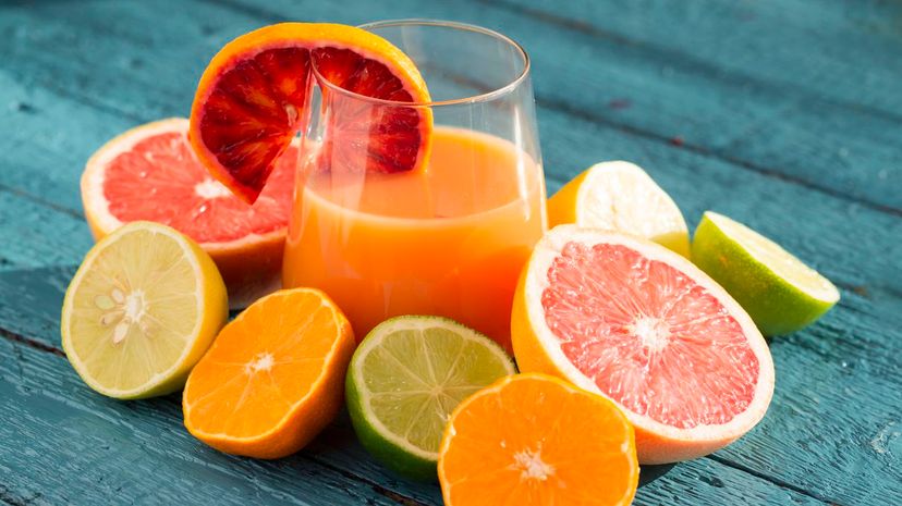 Variety of citrus fruits and juice