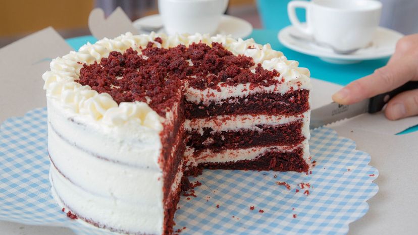 Slicing raspberry cake