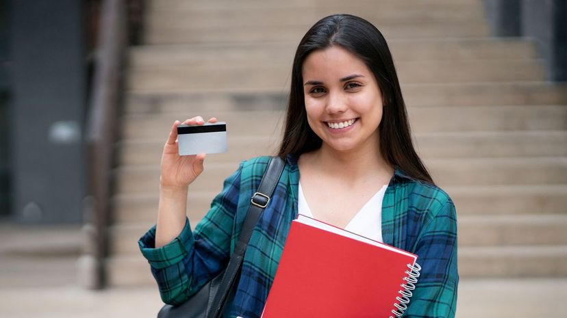 Female student holding a card
