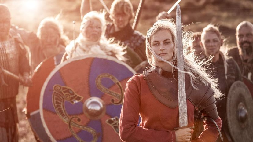 Female warrior and hoard of vikings