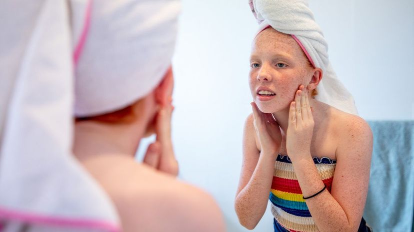 Girl looking at mirror