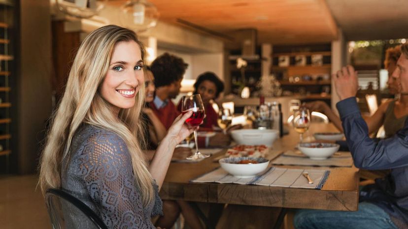 smiling woman at dinner