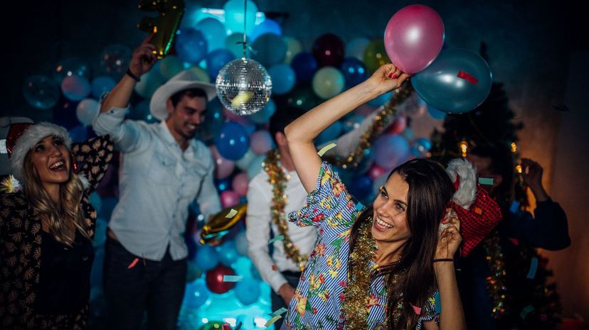 Group of friends having a new year party and dancing