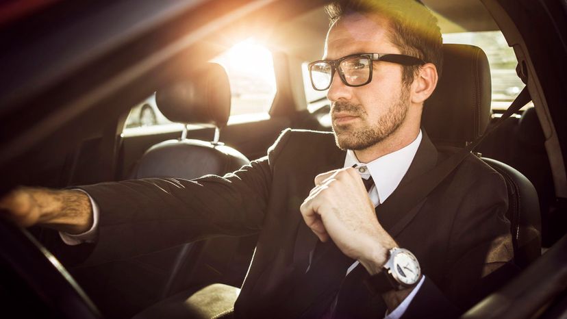 attractive man glasses businessman in car serious scruffy