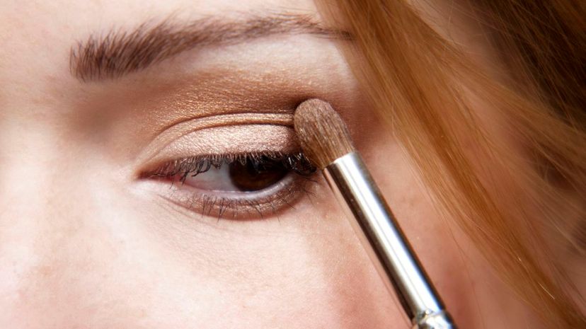 Girl applying eyeshadow