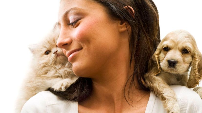 Woman with cat and dog