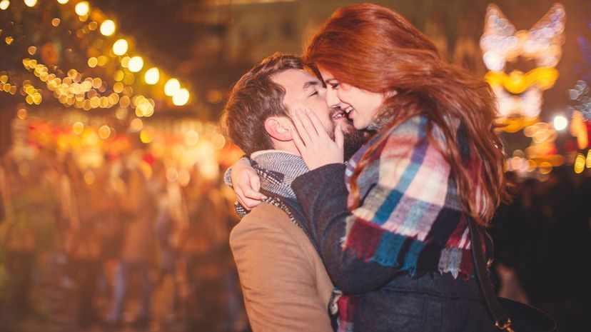 Couple Kissing at Christmastime