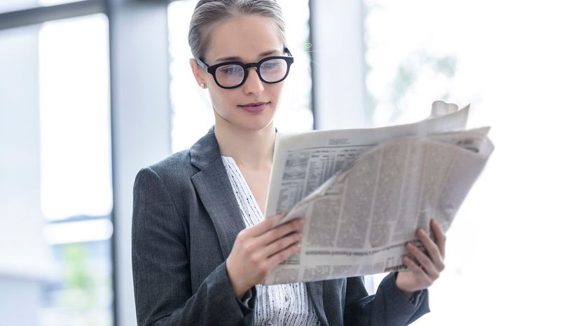 woman reading newspaper