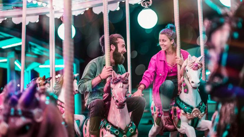 Couple smiling merry-go-round