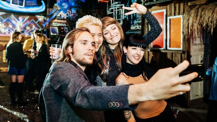 Friends Take Selfie Together On Dance Floor At Open Air Nightclub