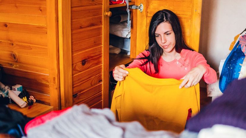 Woman sorting out wardrobe