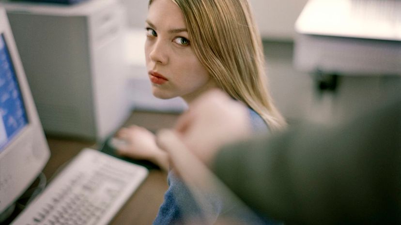 Woman at Desk Giving Dirty Look