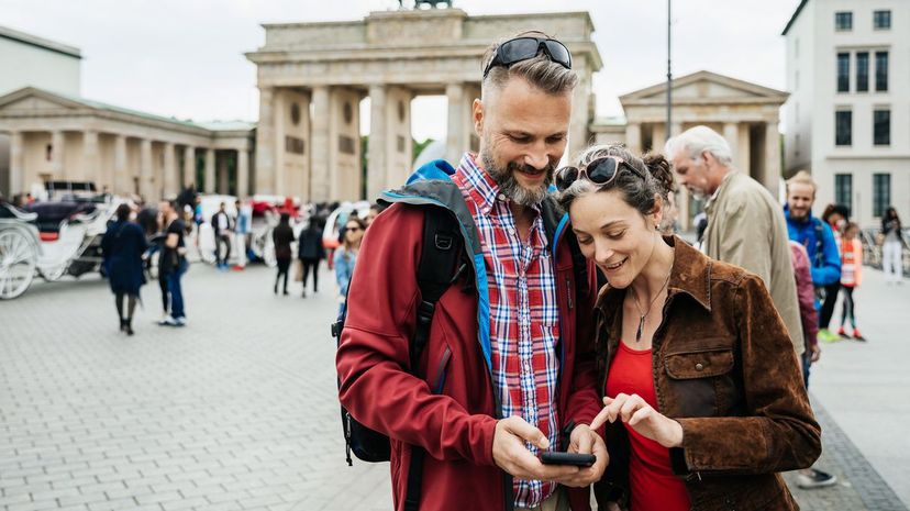 Tourists looking over photos