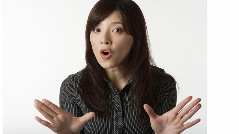 Woman making warning gesture