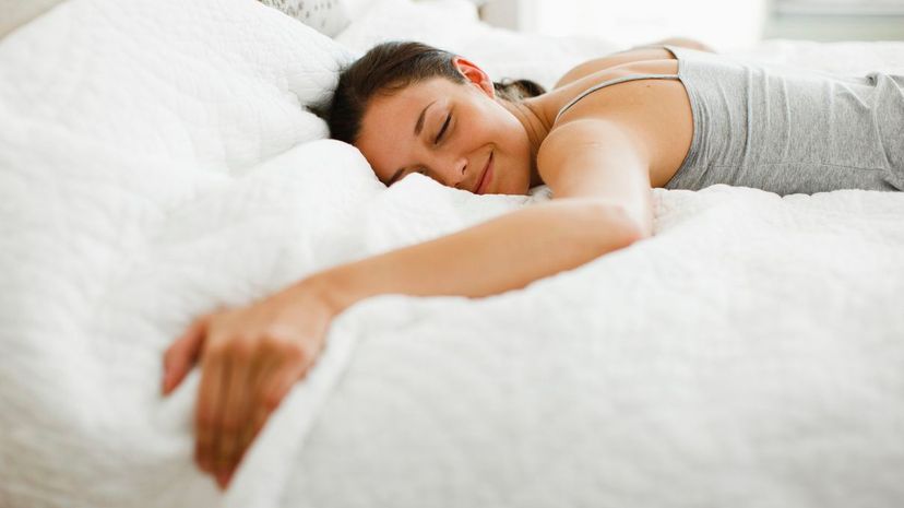 Happy Woman in Bed