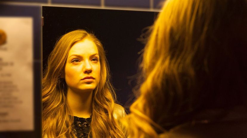 Girl looking at mirror