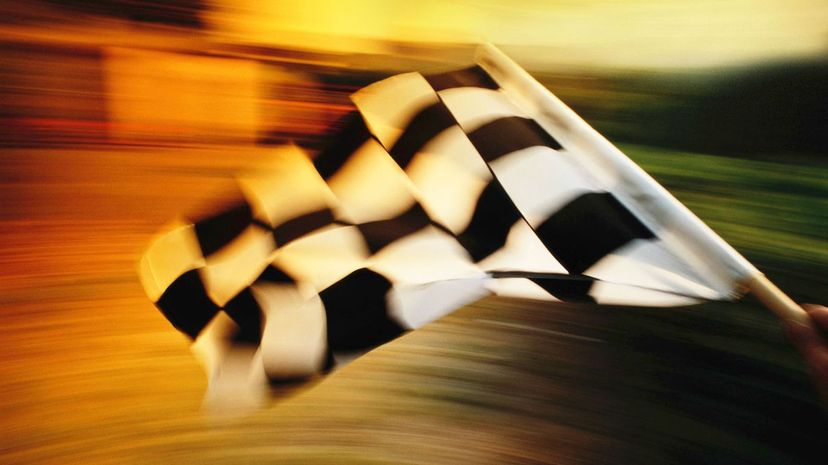 Checkered flag waving at an car race