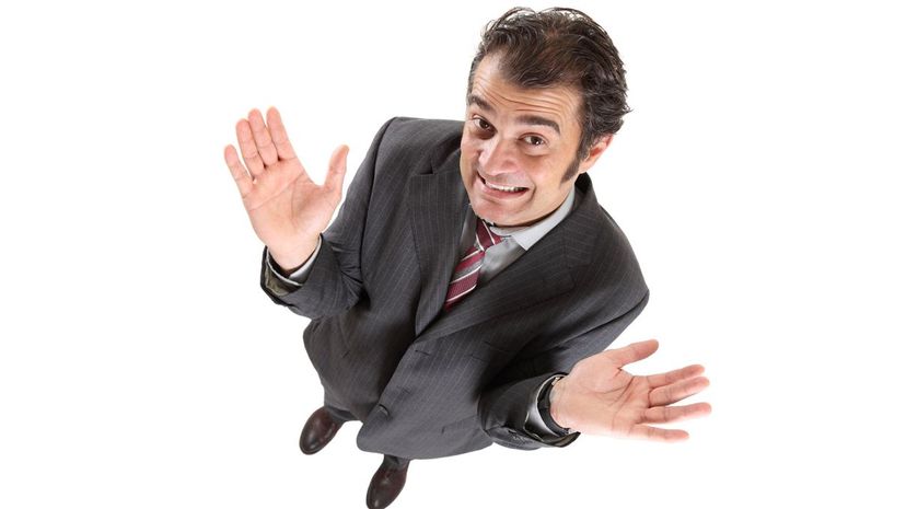 Man lifts his hands, not knowing what to do.