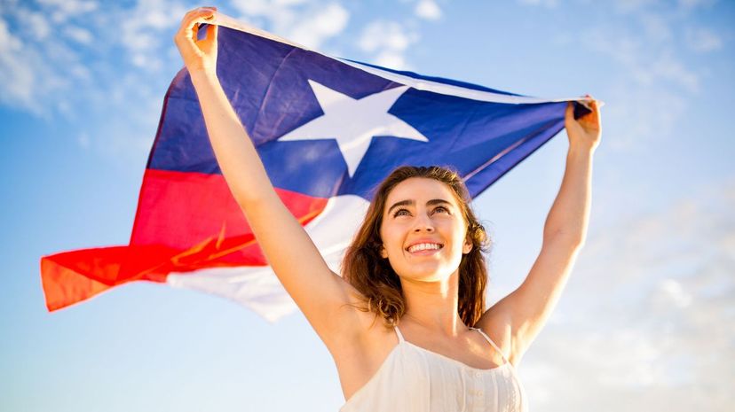 Woman proudly waving flag of Texas