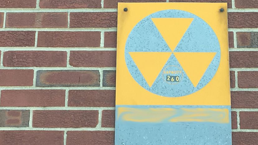Yellow and black fallout shelter signs