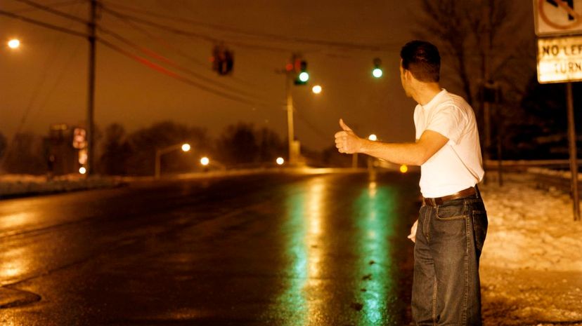 Man Hitchhiking at night