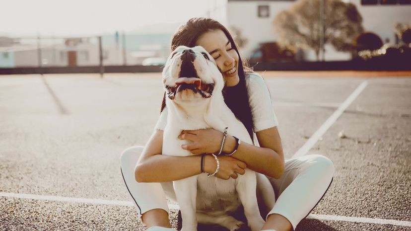 Woman hugging dog