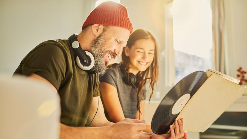 Father and daughter listening music