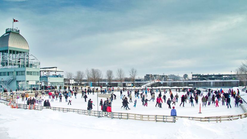 People skating on ice rink in Old port of Montreal