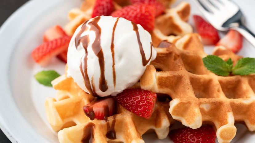 Belgian waffles with ice cream, srawberries and chocolate sauce
