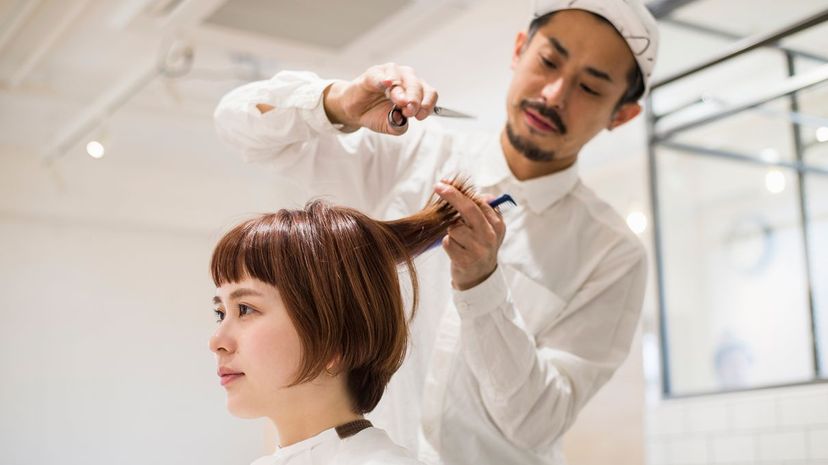 Woman getting haircut