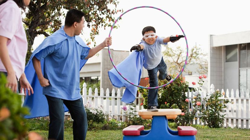 Father and son playing superhero