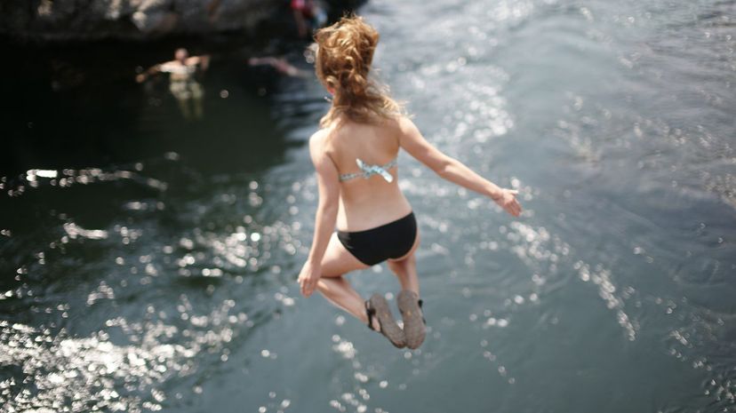 Woman Cliff Jumping