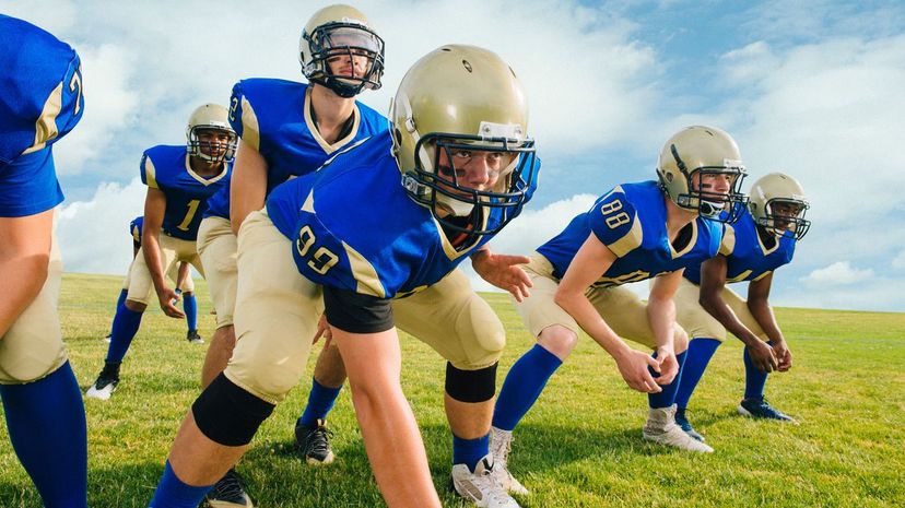 Team of teenage and adult American football players